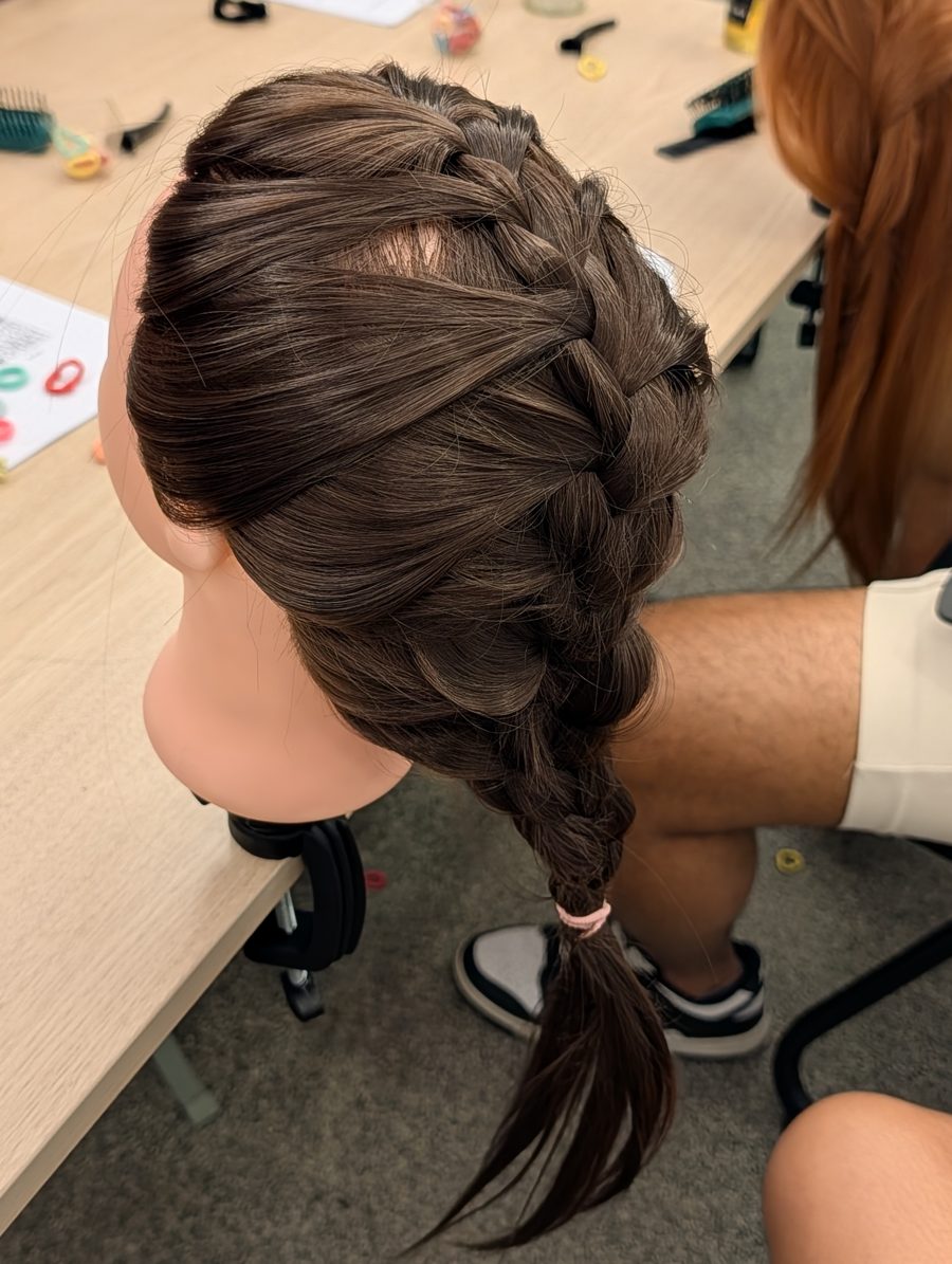 A neat fishtail braid done by a dad at the workshop